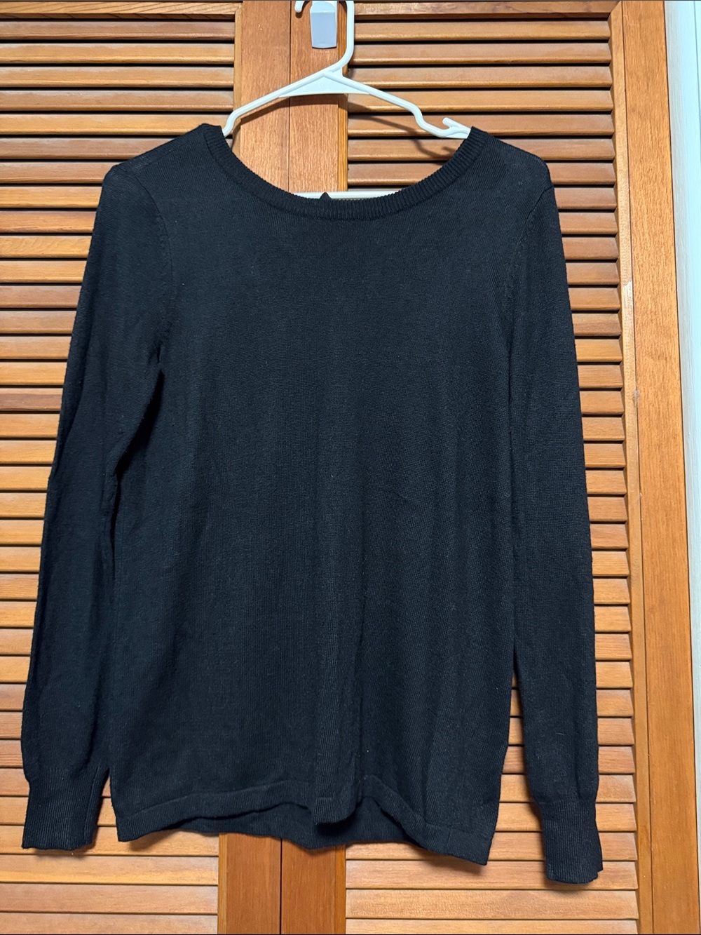 Classic Black Crewneck Sweater with Bow Tie on Back